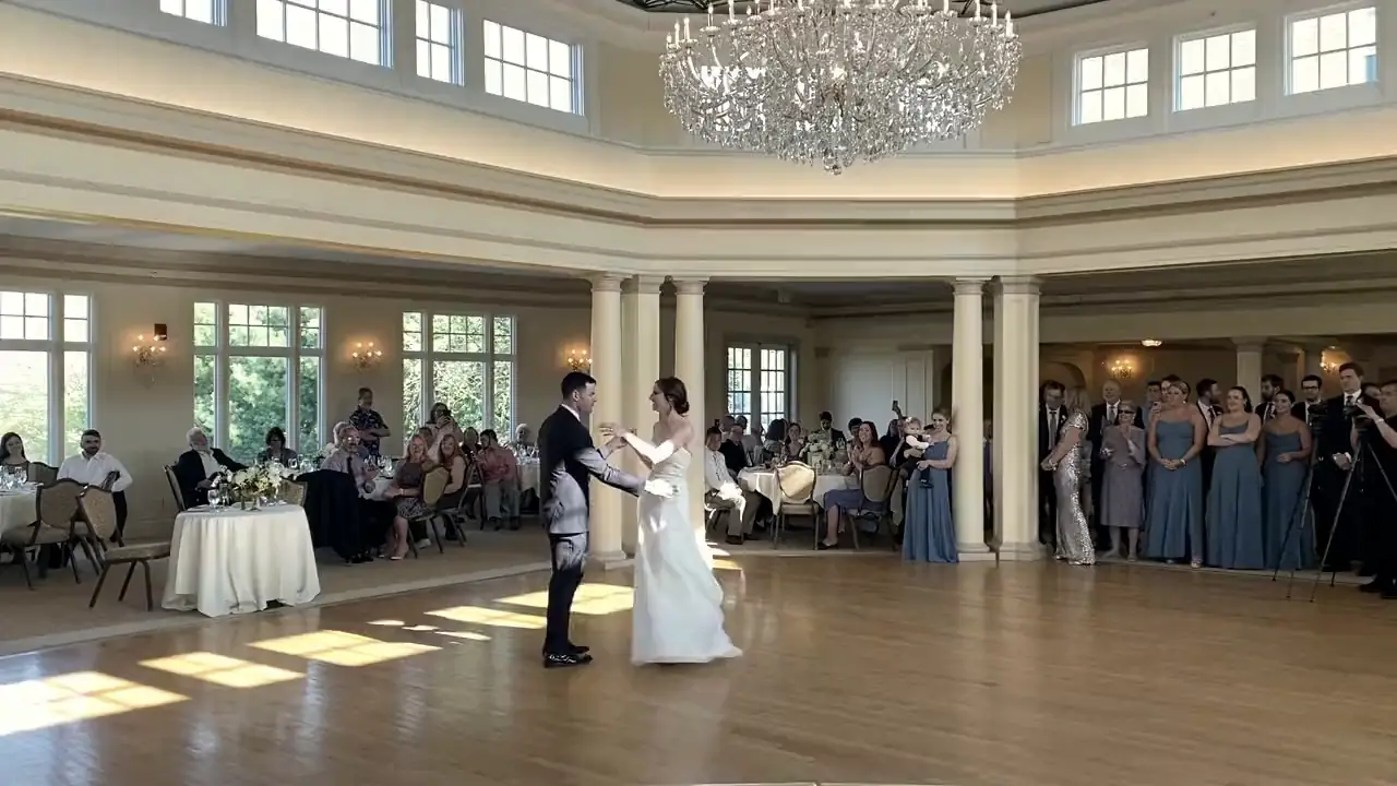 A couple's first dance and a packed dance floor at a Sky Events wedding